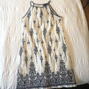 Cute off-white summer dress with blue pattern
